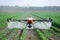 agricultural drone spraying crops in a vast field