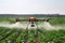 agricultural drone spraying crops in a vast field