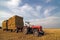 Agricultural Equipment red tractor with straw on t