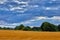 Agricultural field with dark moody clouds