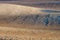 Agricultural field, fallow sloped cultivated farmland in Hungary