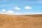 Agricultural field with soil and blue sky