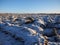 Agricultural field under the first snow. The clods of earth, field, plowed