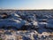 Agricultural field under the first snow. The clods of earth, field, plowed