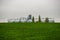 Agricultural green wheat field and granary