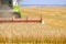 Agricultural harvester mows wheat