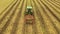 Agricultural industry.Modern Technologies of Onion Harvesting. A Tractor with Attachments moves through an Onion Field