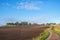 Agricultural land view with a winding country road