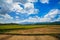 The agricultural landscape and natural mountains