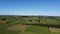 Agricultural landscape of West Cork on a summer afternoon, top view. Vast green farm fields. Picturesque landscape. Green grass