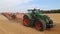 Agricultural machinery - tractors, seeders, sprayers and cultivators work in the field