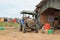 Agricultural motorcycle beside Farmer work house