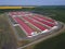 Agricultural plant farm, A modern enterprise for the production of livestock products. Aerial view. Sunny morning, spring summer