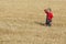 Agricultural scene, farmer or agronomist inspect wheat field