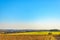 Agricultural scene: Landscape of a farm and a clear blue sky