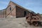 Agricultural shed building and vintage farm machinery in rural N