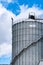 Agricultural silo at feed mill factory. Big tank for store grain in feed manufacturing. Seed stock tower for animal feed