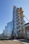 Agricultural Silos. Building Exterior. Storage and drying of grains, wheat, corn, soy, sunflower against the blue sky