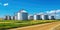 Agricultural Silos - Building Exterior, Storage and drying of grains, wheat, corn, soy, sunflower against the blue sky with rice