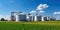 Agricultural Silos - Building Exterior, Storage and drying of grains, wheat, corn, soy, sunflower against the blue sky with rice