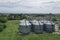 Agricultural silos on the farm, close-ups from above with a drone. Farm Industrial granary, elevator dryer, building exterior