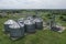 Agricultural silos on the farm, close-ups from above with a drone. Farm Industrial granary, elevator dryer, building exterior,