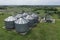 Agricultural silos on the farm, close-ups from above with a drone. Farm Industrial granary, elevator dryer, building exterior,