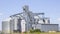 Agricultural Silos. Storage and drying. Storage of crop. Grain elevator. Metal grain elevator in agricultural zone. Agriculture