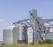 Agricultural Silos. Storage and drying. Storage of crop. Grain elevator. Metal grain elevator in agricultural zone. Agriculture