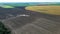 Agricultural tractor performing fall tillage in stubble field