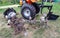 Agricultural walk-behind tractor with a set of attachments, hiller, milling cutters and lugs. Two-wheel tractor