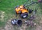 Agricultural walk-behind tractor with a set of attachments, hiller, milling cutters and lugs. Two-wheel tractor