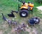 Agricultural walk-behind tractor with a set of attachments, hiller, milling cutters and lugs. Two-wheel tractor