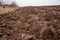 Agricultural work with tractors, plowing the land.