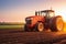 Agricultural Workers with Tractors Ploughing a Field at Sunset.