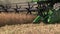 Agriculture combine machine harvest ripe dry pea grow