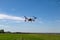 Agriculture drone fly to sprayed fertilizer on the fields. Industrial agriculture and smart farming