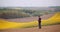 Agriculture - Farmer or Agronomist Walking on Field Looking at Crops.