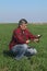 Agriculture, farmer examine wheat plant in field