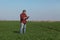 Agriculture, farmer examine wheat plant in field