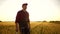 agriculture. farmer hand with digital tablet at sunset in wheat field. agriculture business plants concept. farmer