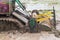 Agriculture farmland,tractor with plough ploughing a soil field