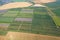 Agriculture fields in countryside in summer day aerial view. Harvest time