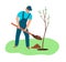 Agriculture and gardering concept. a man plants a tree.