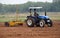 A agriculture landscaped and a tractor