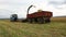 Agriculture machinery harvesting at farmland