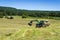 Agriculture machinery on hay field