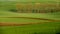 Agriculture on Moravia rolling hills with wheat filds and tractor