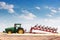 Agriculture plowing tractor on wheat cereal field