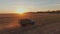 agriculture. retro truck carries a wheat grain harvested across the field at sunset. business agriculture concept. retro